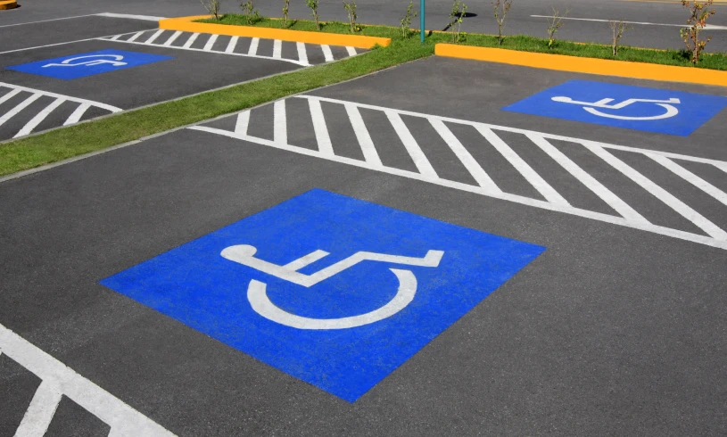 Blue wheelchair symbols on parking lot