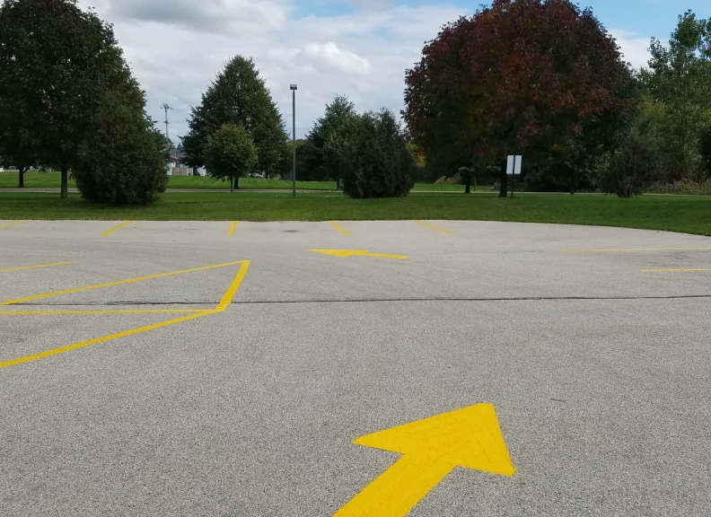 Parking lot with yellow arrows