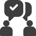 Two figures with speech bubbles and checkmark